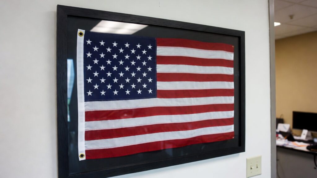 flag framing Littleton CO featuring framed American flag displayed in office interior